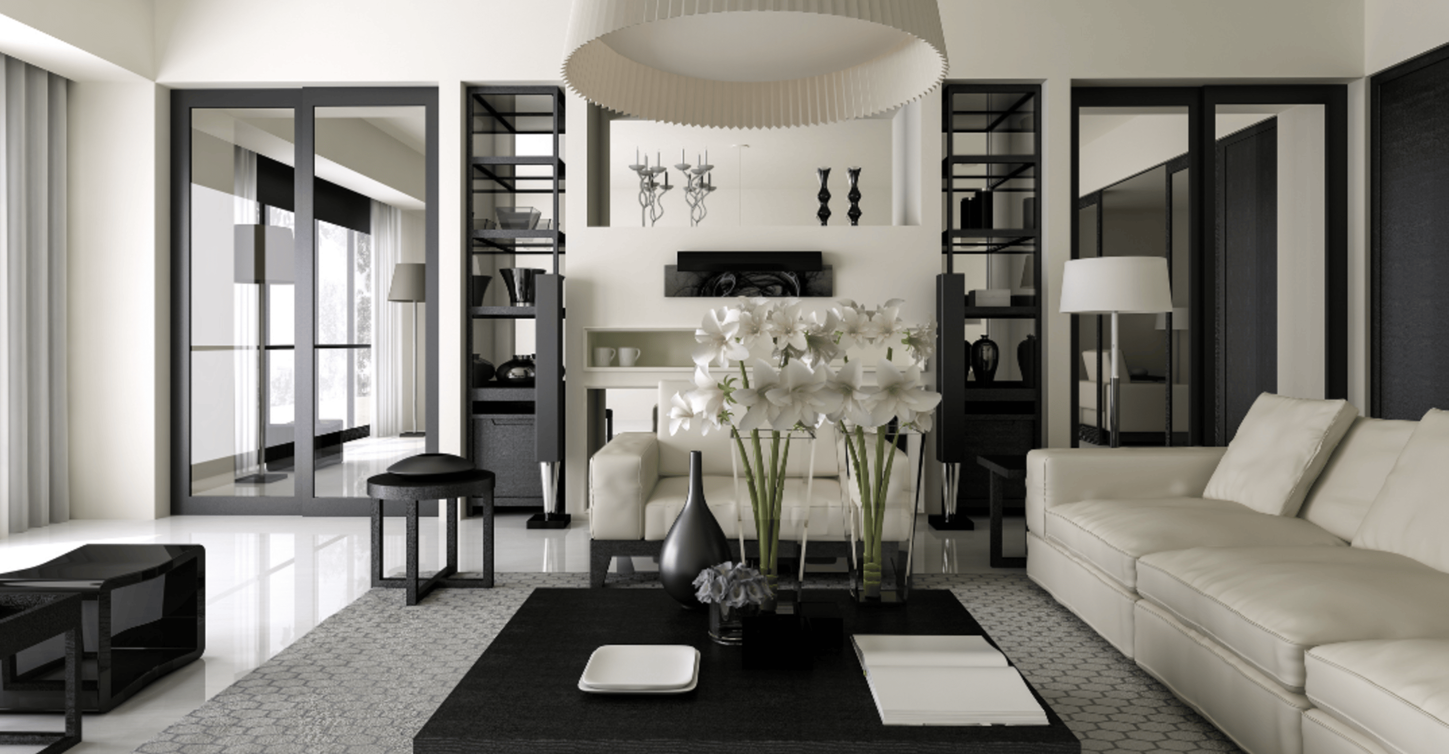 living room of a home with white walls, a white couch, black furniture, and black room accents