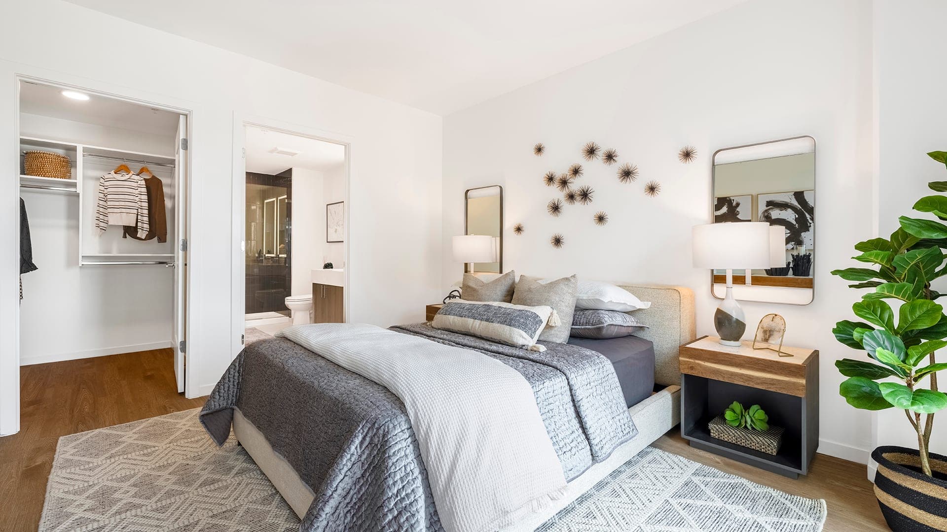 Bedroom featuring large light colored rug that matches the room design perfectly. 